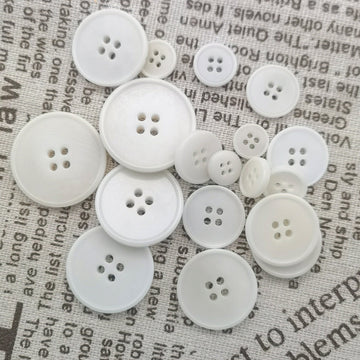 White knit buttons, 4-hole, assorted sizes