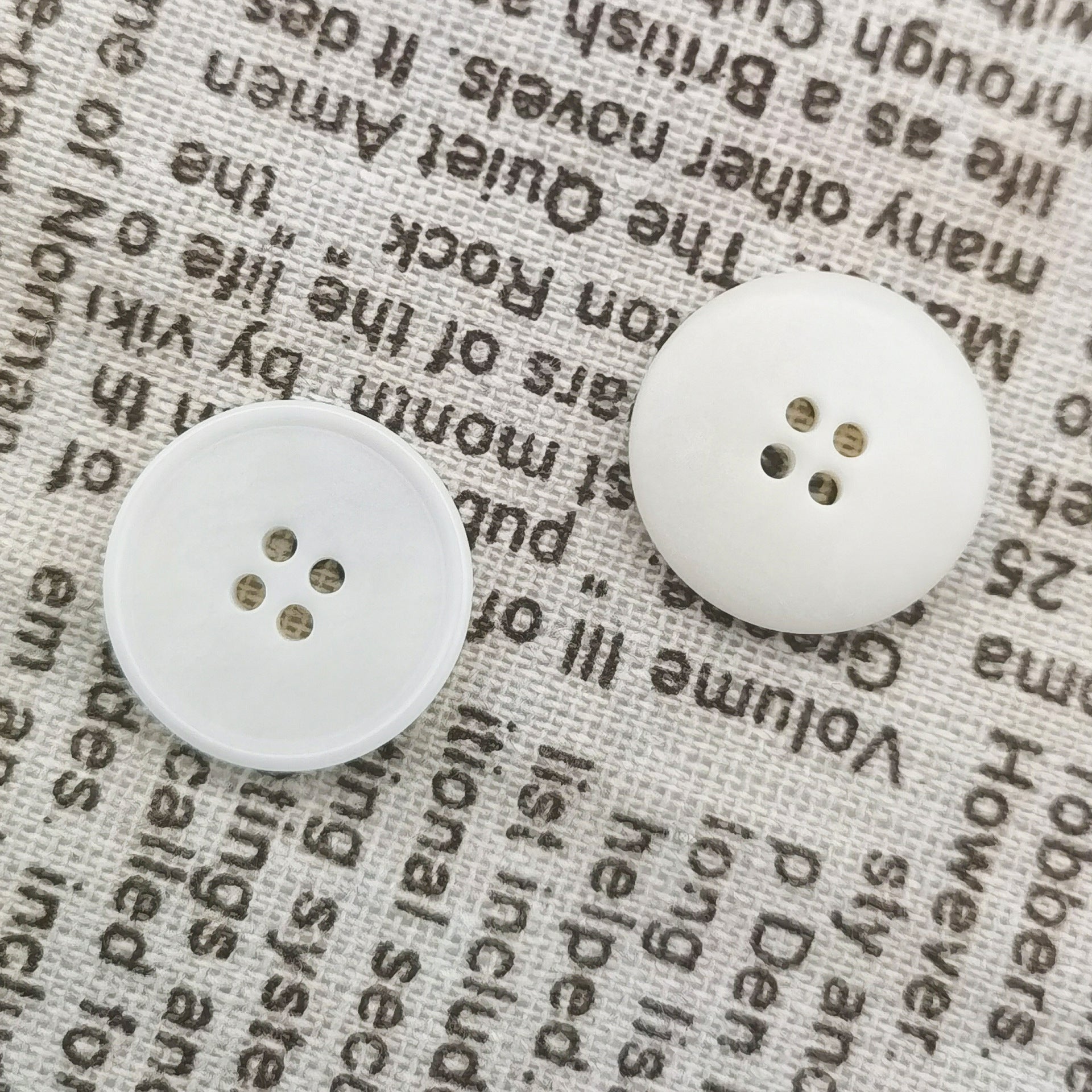 White knit buttons, 4-hole, large and smaller buttons