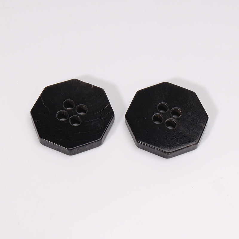 Two black octagonal 4-hole horn buttons, 20mm—neat front faces
