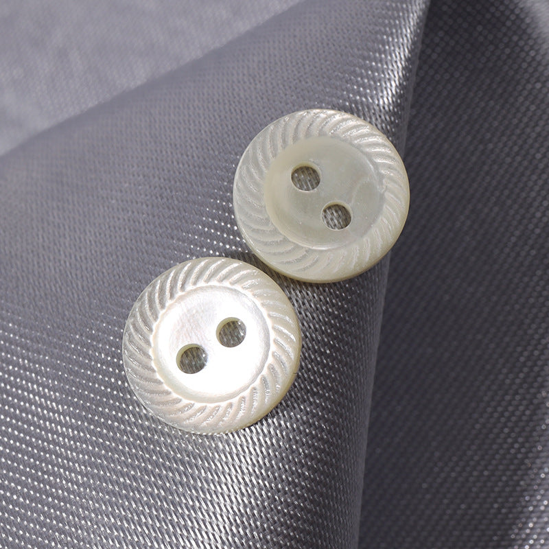 Pair of white shell buttons, 9–11.5mm, two-hole design with textured edge