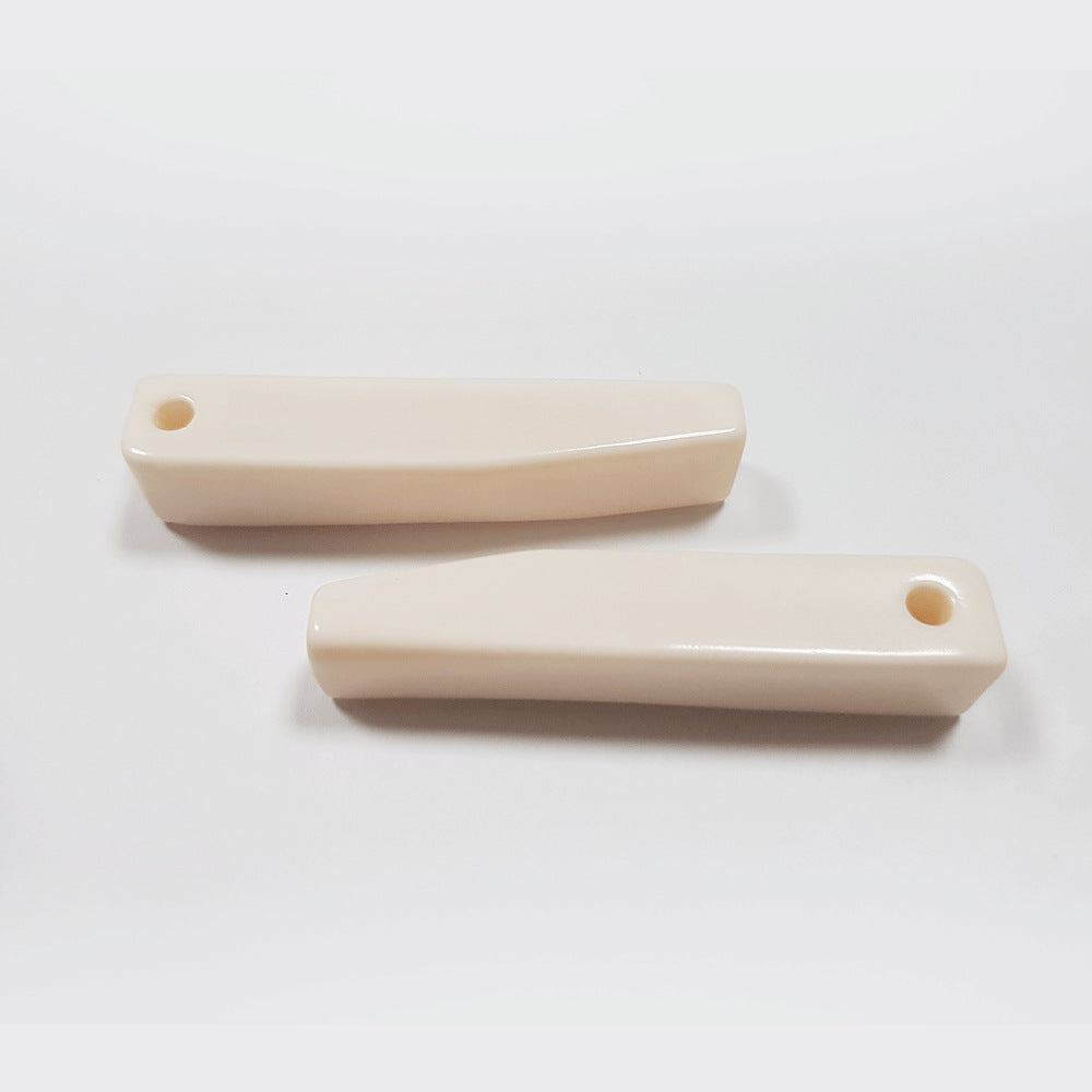 Ivory white rectangular coat buttons, 56mm, two pieces, end holes visible