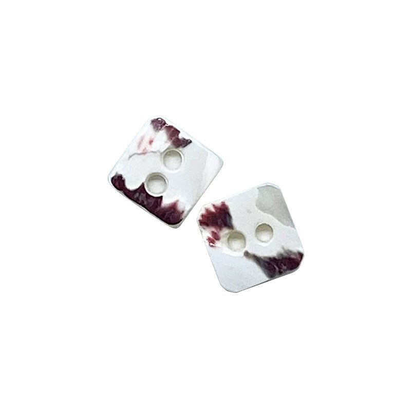 Natural conch shell square buttons, two-hole design, purple marbled accents (2 shown)