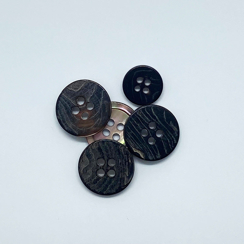 Round 4-hole shell buttons, coffee-toned, five-piece arrangement, front views