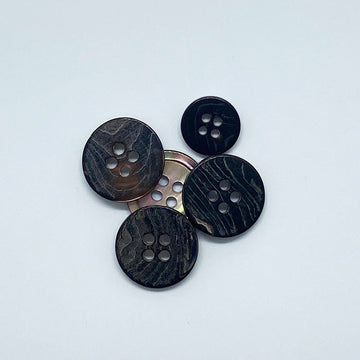 Round 4-hole shell buttons, coffee-toned, five-piece arrangement, front views