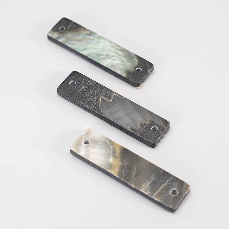 Rectangular shell buttons, wide edge, dark and iridescent panels with round sew holes