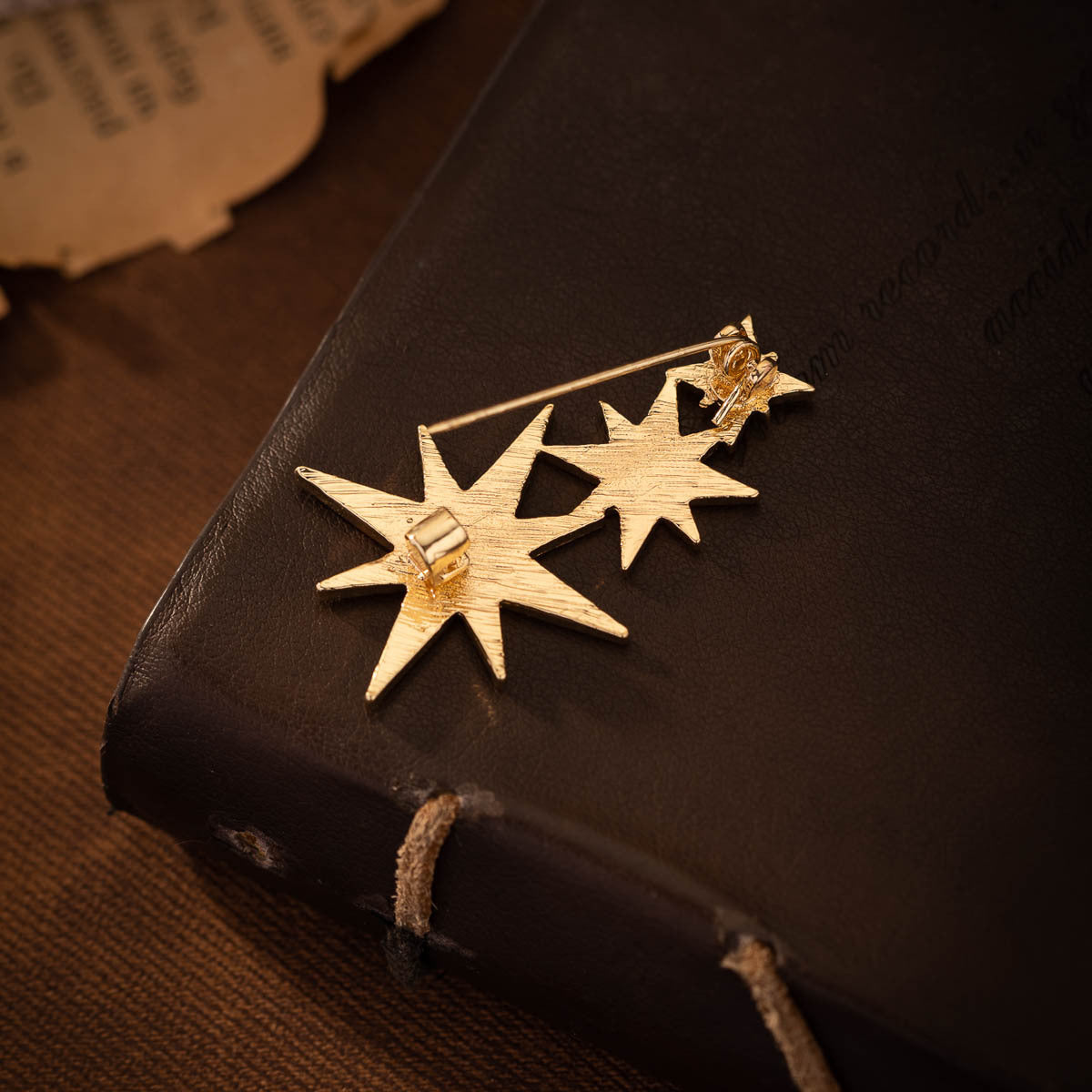 Gold star pin brooch with clear rhinestone, two-star layout