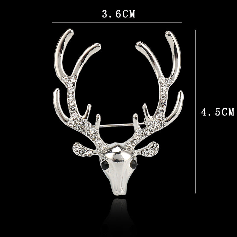 Rhinestone reindeer metal pin brooch, silver-tone; 3.6 cm x 4.5 cm