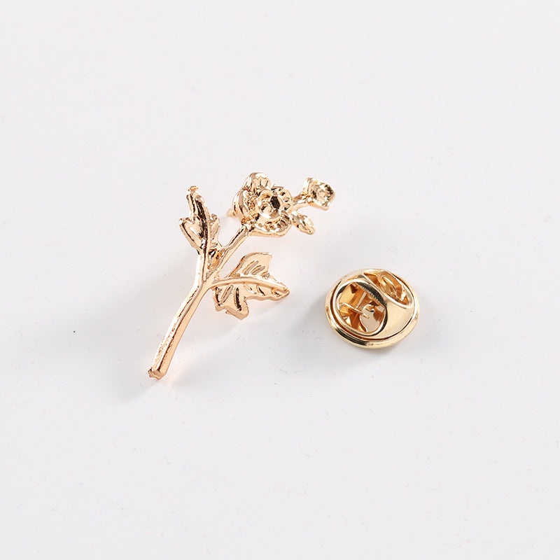 Gold brooch pin back with butterfly clasp and rose branch design