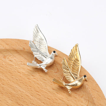 Dove metal lapel pin, silver tone with winged bird design and black eyes