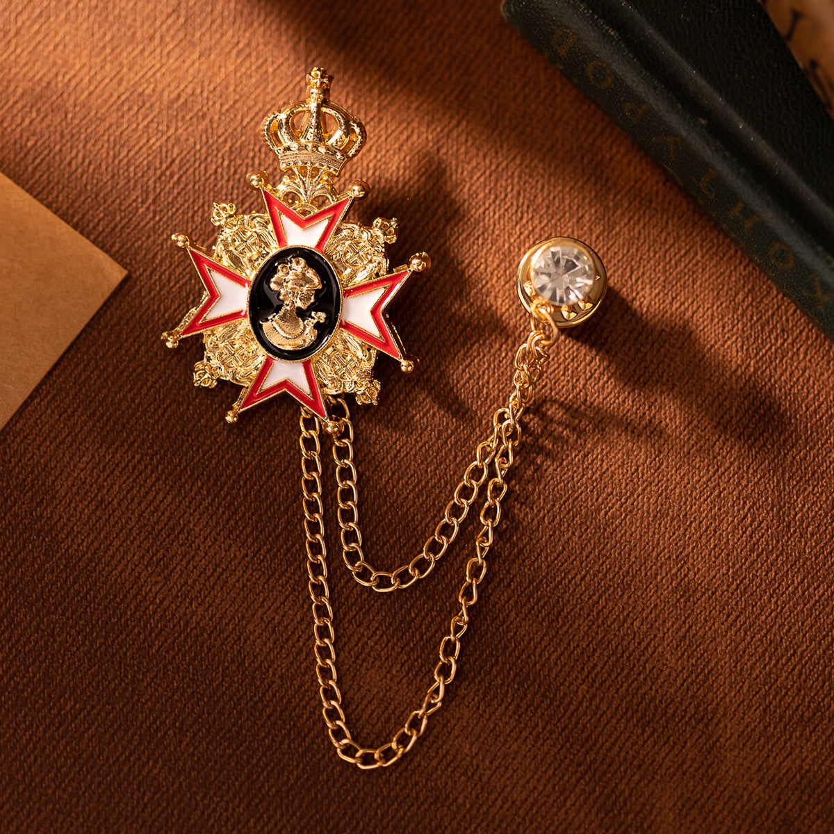 Queen portrait brooch pin with crown, gold filigree star and linked chain with round stone