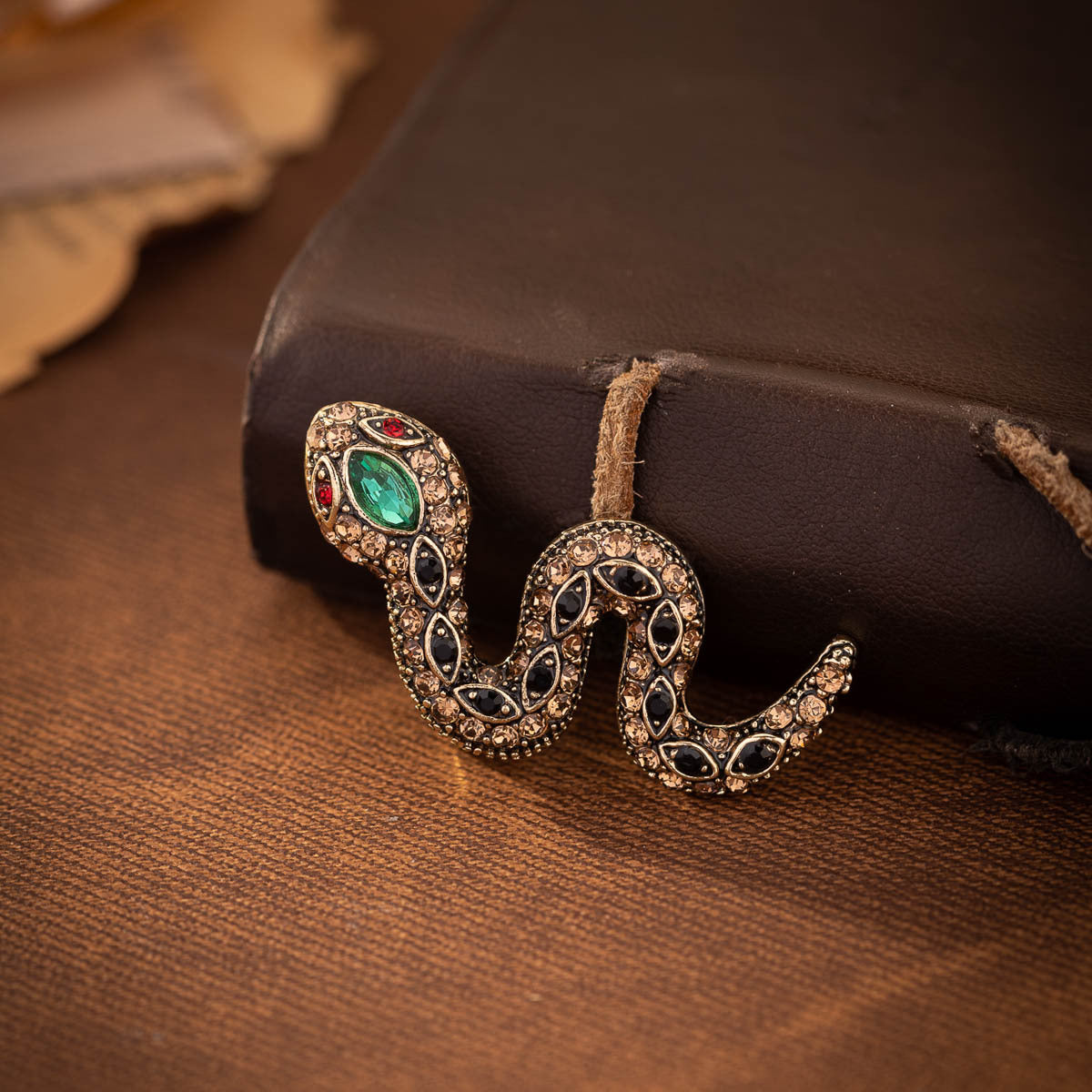 Retro rhinestone snake brooches, gold-tone with teal-green oval and dark accents