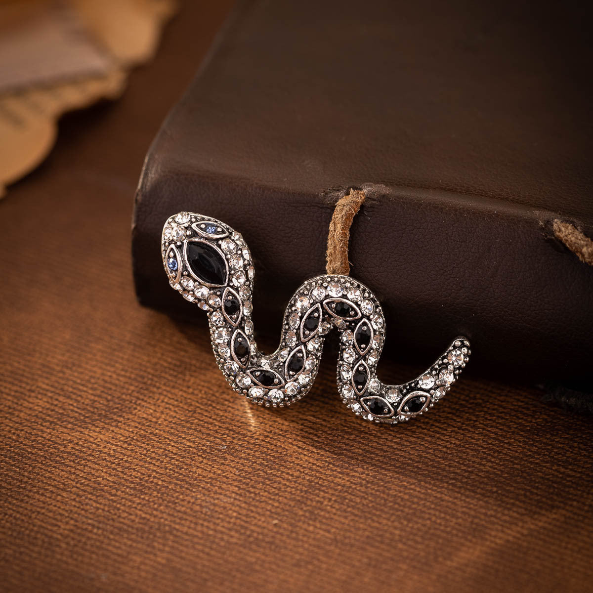 Retro rhinestone little snake brooch pair with blue center oval and dark stones