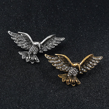 Two-pack retro eagle wing brooches: silver-tone and gold-tone rhinestone designs