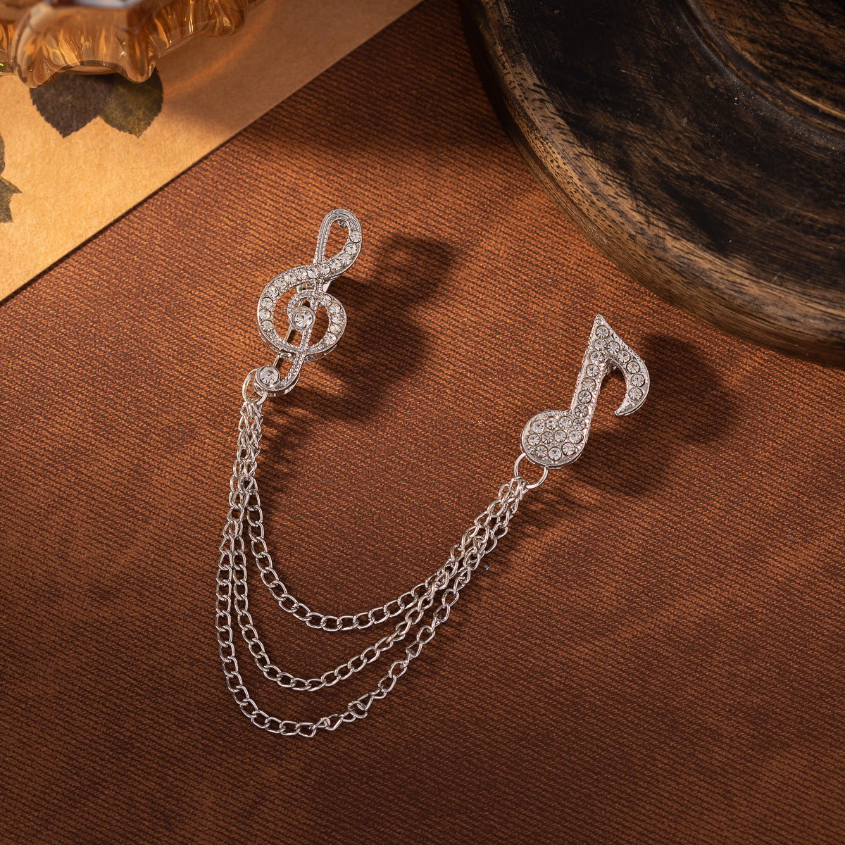 Silver-tone diamond music note brooch with tassel chain links, two-pack