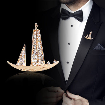 Gold-tone rhinestone sailboat lapel pin brooch, vertical sail design