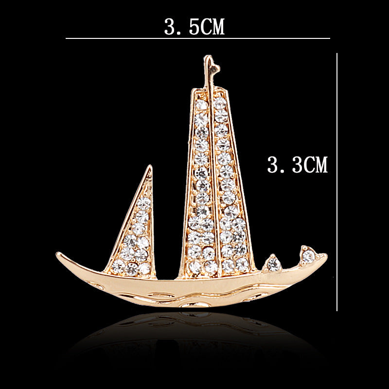 Sailboat brooch dimensions 3.5cm x 3.3cm, gold-tone rhinestone design