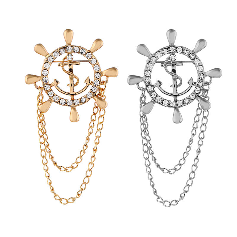 Pair of anchor and rudder wheel chain brooches, gold and silver with rhinestone trim