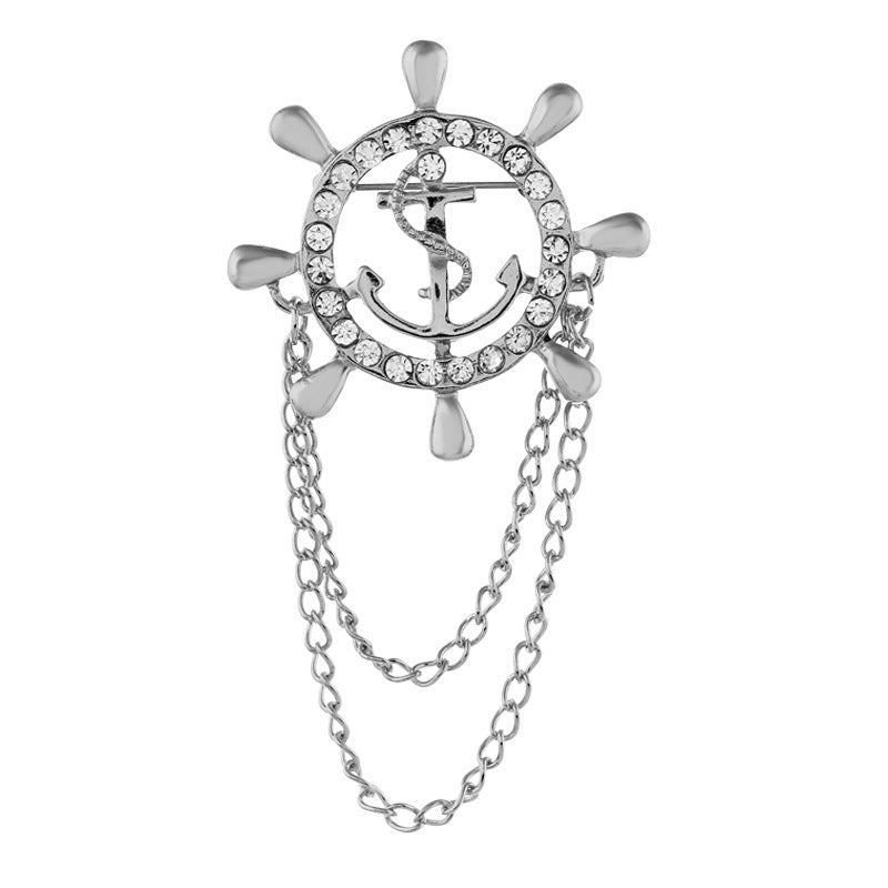 Silver anchor and rudder wheel chain brooch with rhinestone border and dangling chains
