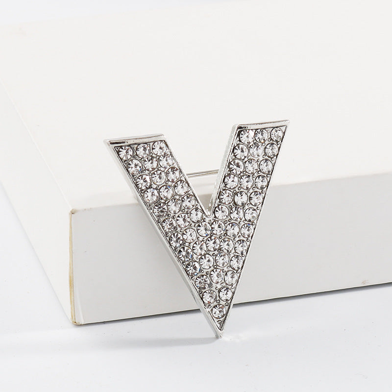 Silver V-shaped rhinestone corsage collar pin, pointed triangle with glittering stones