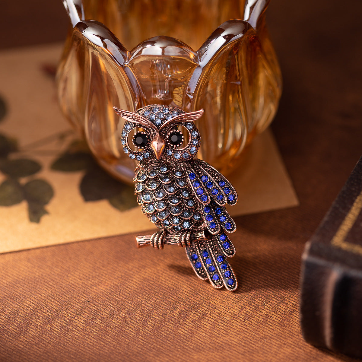 Owl brooch with dangling body, blue enamel feathers and sparkling rhinestones