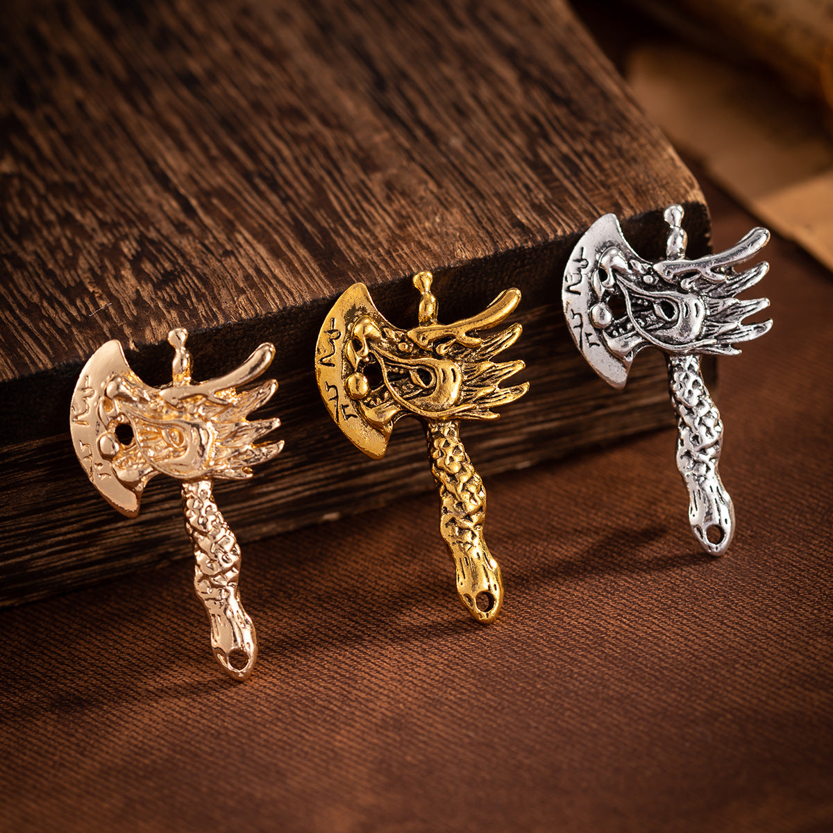 Vintage distressed dragon head axe brooch set of 3 in gold and silver tones