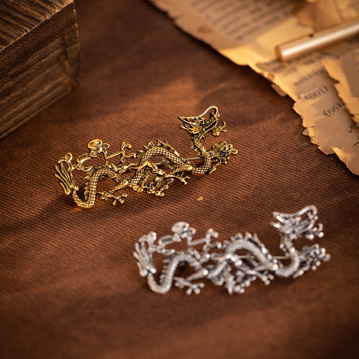 Gold Chinese dragon totem brooch with ornate textured details and pin back