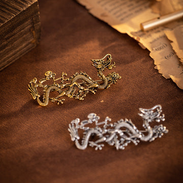 Gold Chinese dragon totem brooch with ornate textured details and pin back