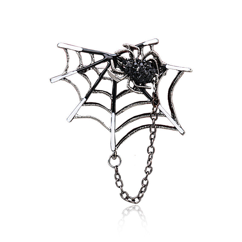 Silver spider-web brooch with black rhinestone spider and dangling chain