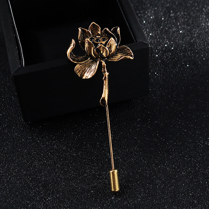 Gold-tone lotus flower stick pin with small cylindrical pin end on box
