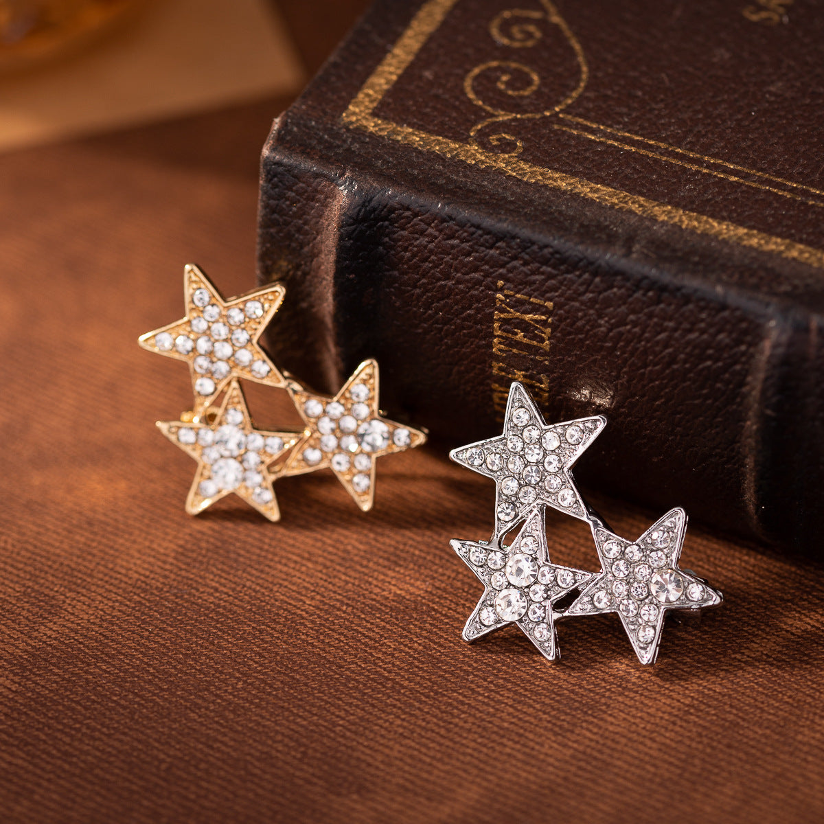 Gold three star diamond lapel pin set, five-point stars with clear stones