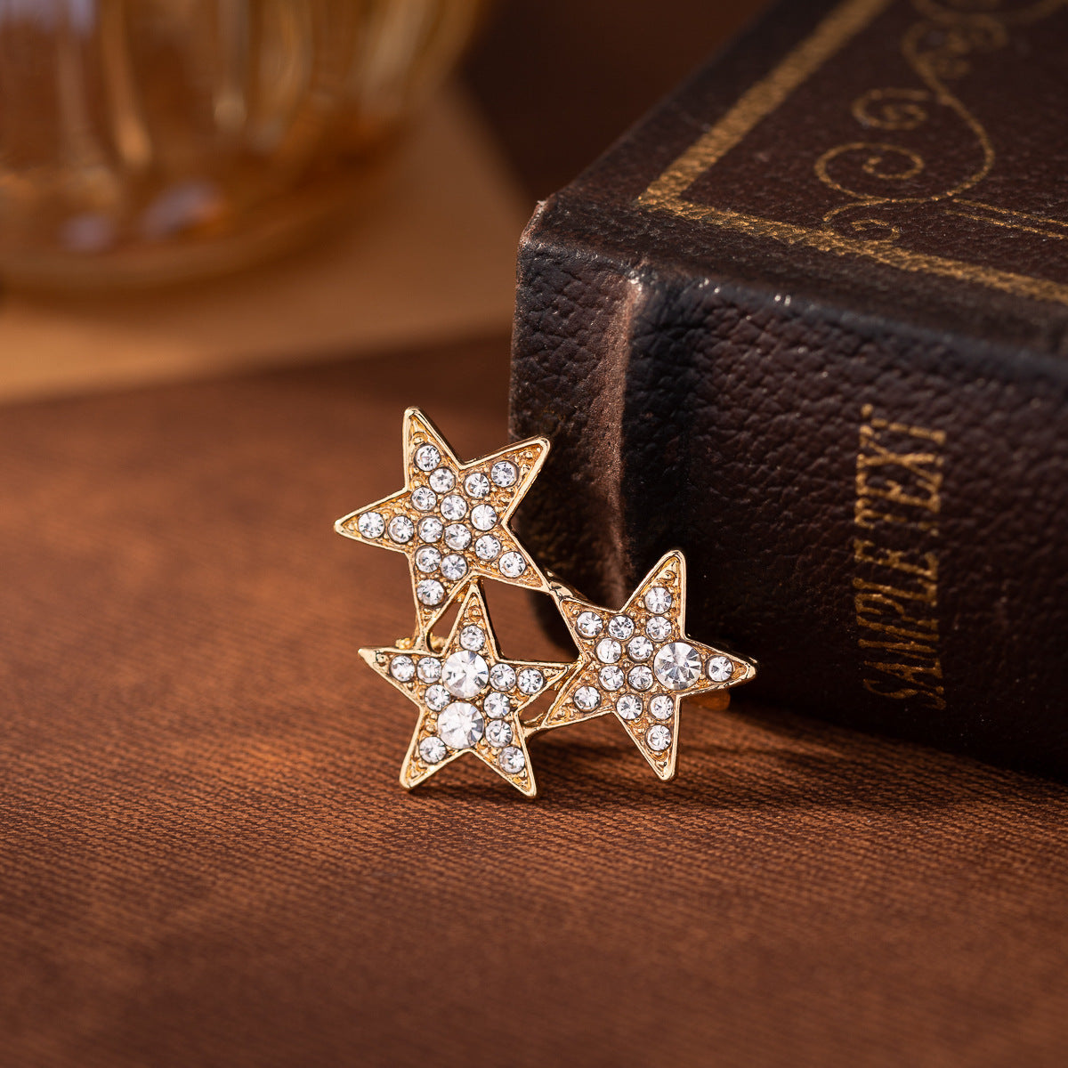 Gold three-piece star lapel pins with rhinestone diamonds on points