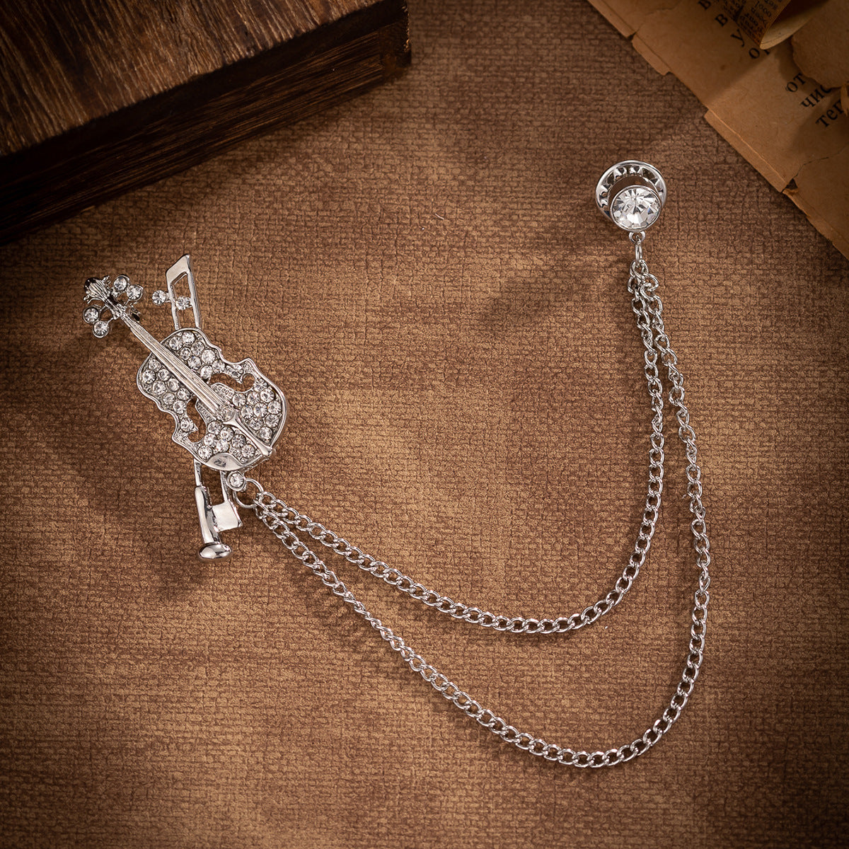 Silver-tone violin brooch tassel badge with rhinestone violin and two-link chain