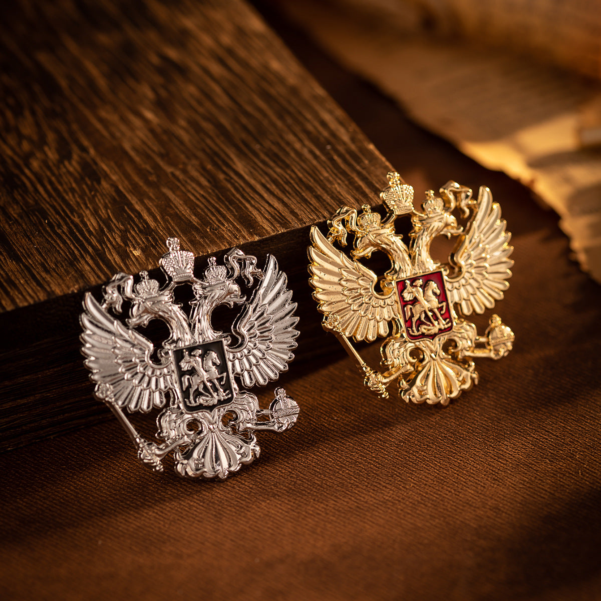 Four-pack brooch pins: gold and silver double-headed eagle knight designs on dark wood
