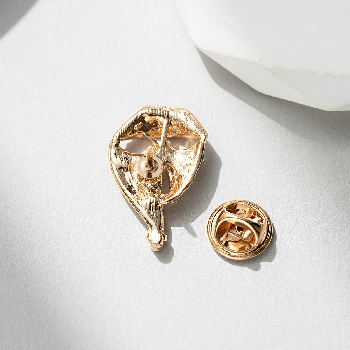 Gold-tone sailboat brooch pin with clasp backing and pin stem
