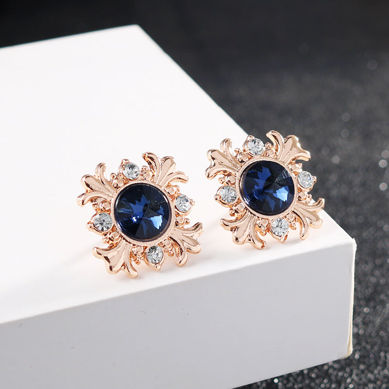 Blue crystal cross lapel pin pair, rose-gold tone with clear stones