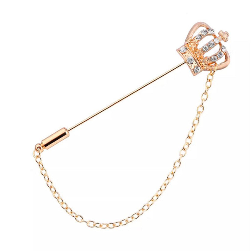Gold-tone long-pin lapel brooch with crown and anchor motifs, chain and rhinestones