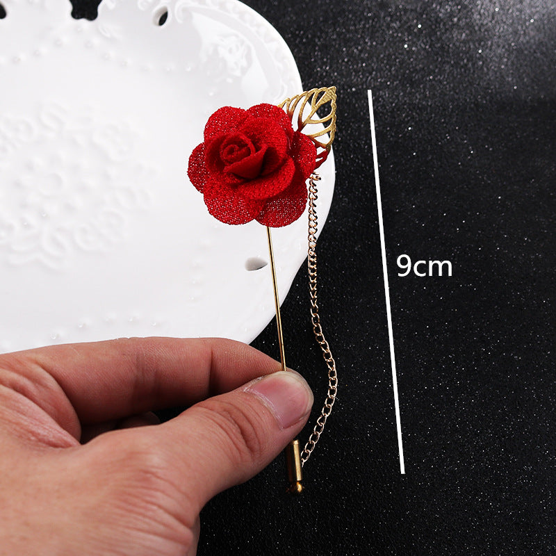 Red flower leaf brooch pin on gold chain, approx. 9cm length