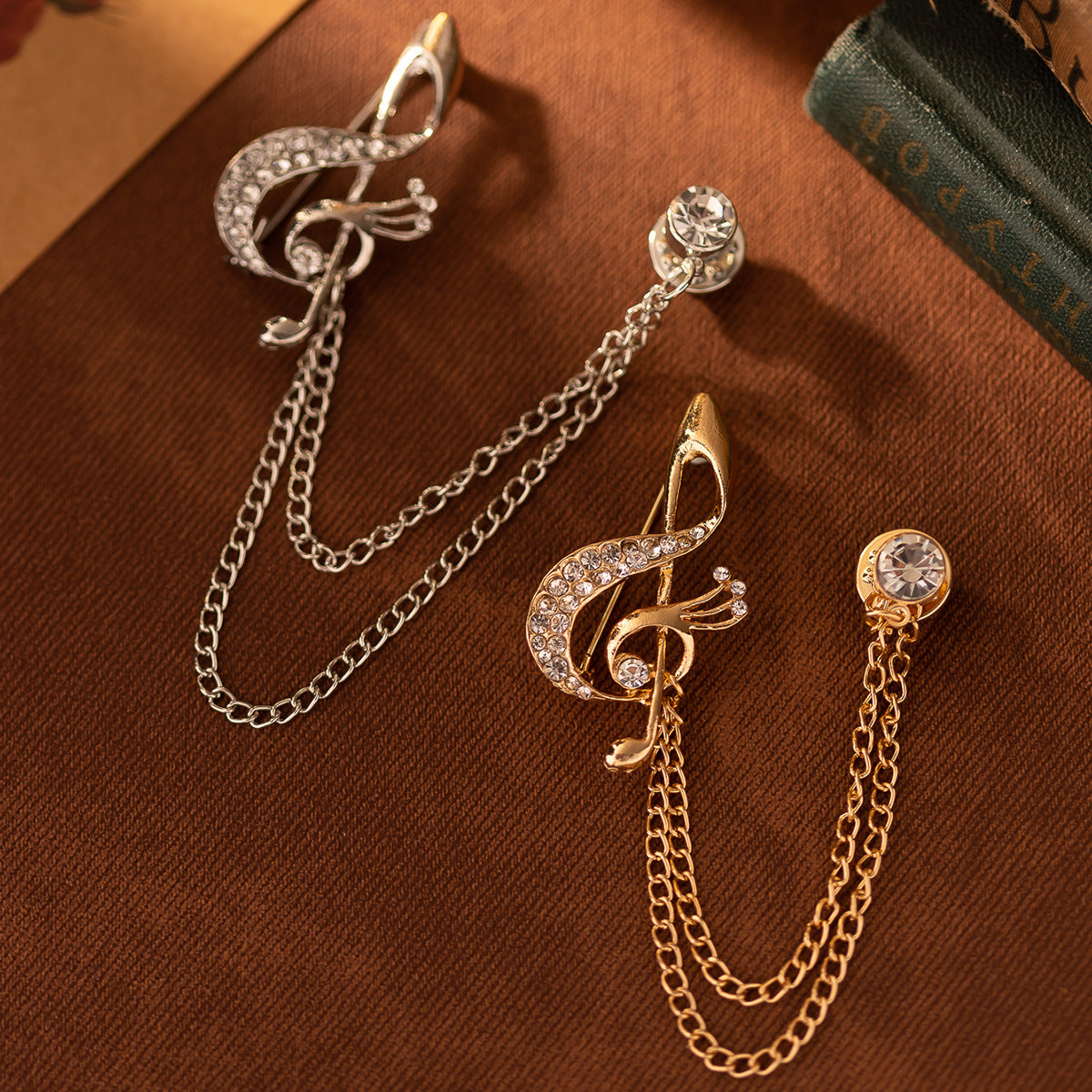 Two-tone musical note rhinestone chain brooch set: gold and silver pieces