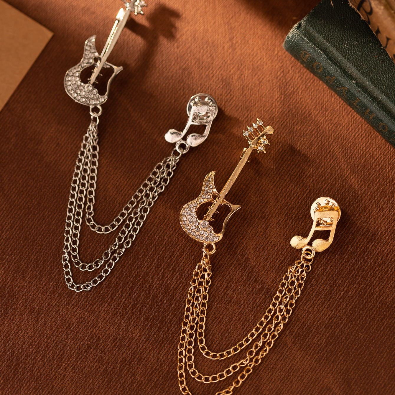 Set of guitar note tassel brooch pins in silver and gold tones with double chains