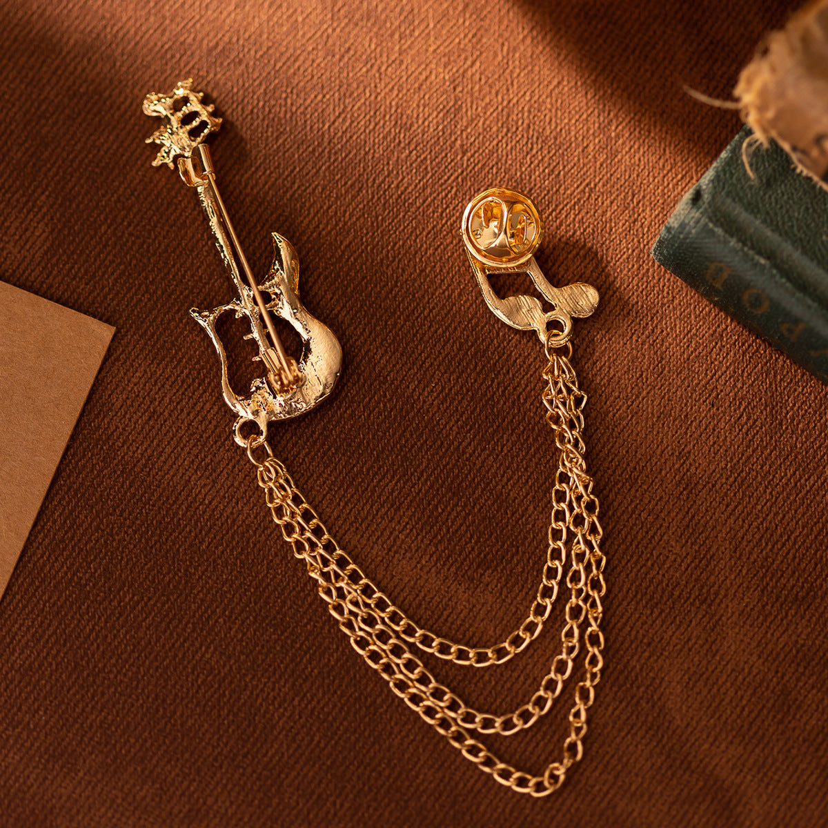 Gold-tone guitar note tassel brooch pin with double-chain tassel, note-shaped charm