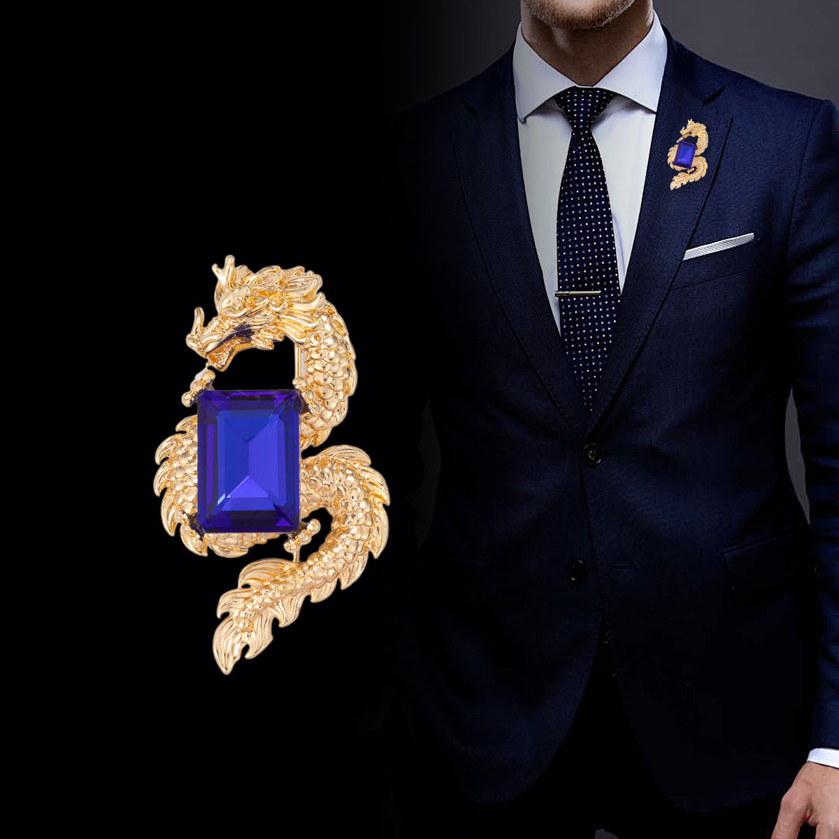 Gold dragon brooch with rectangular blue crystal, pinned on jacket lapel
