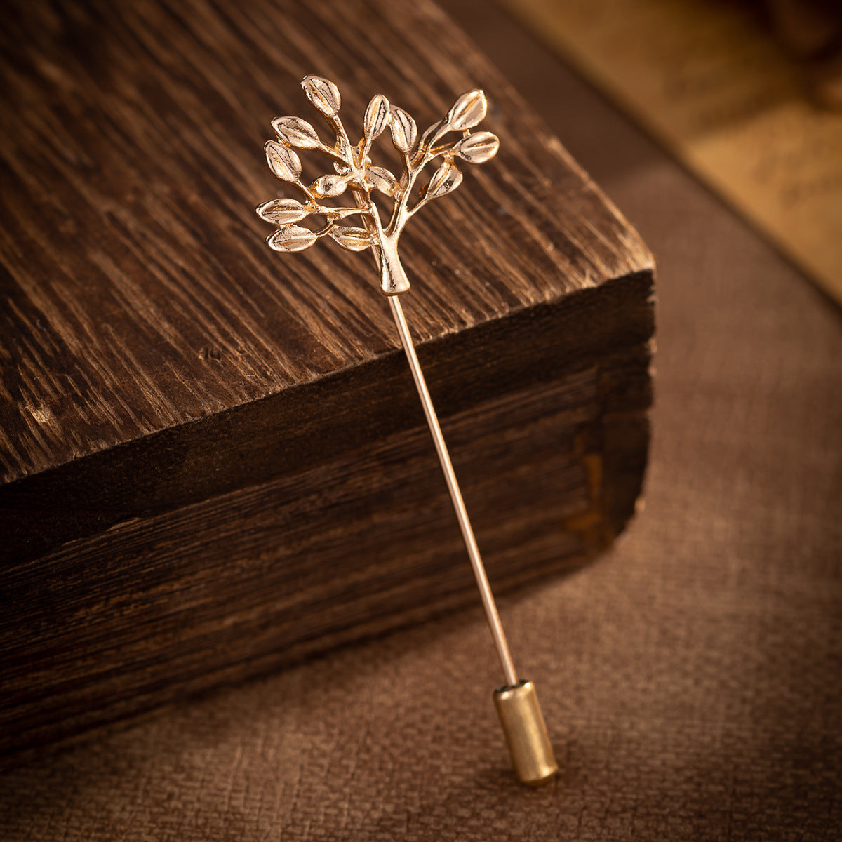 Gold-tone tree or branch brooch pin with leaf cluster and straight post