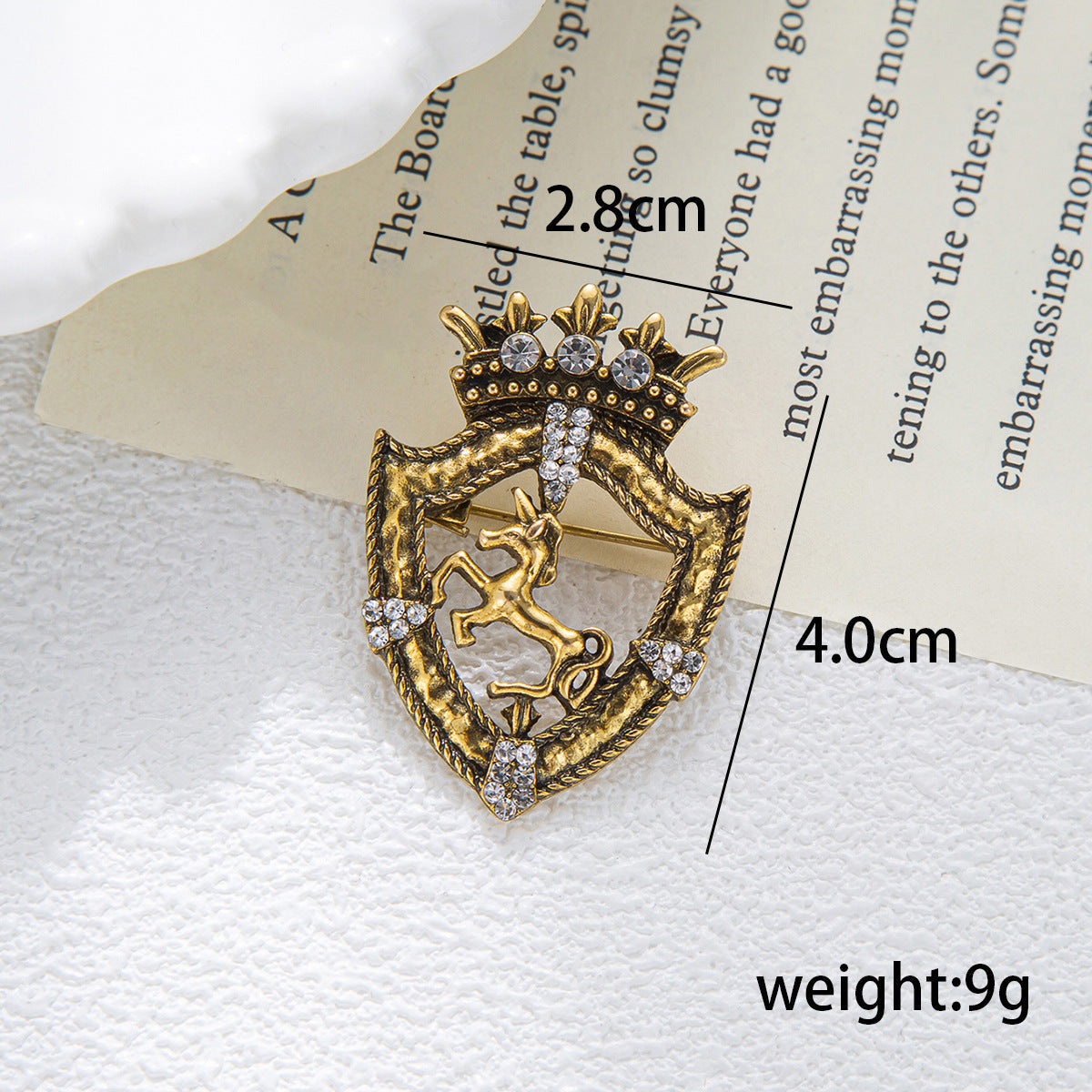 Gold horse shield crown brooch pin with rhinestone details and pin clasp