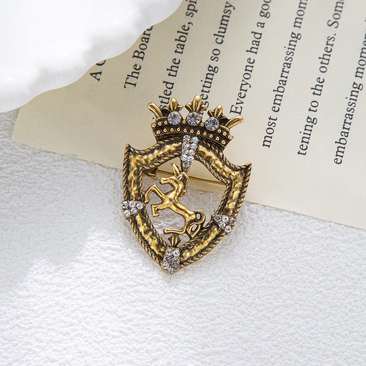 Gold horse shield crown brooch pin on card, sparkling rhinestones and horse detail