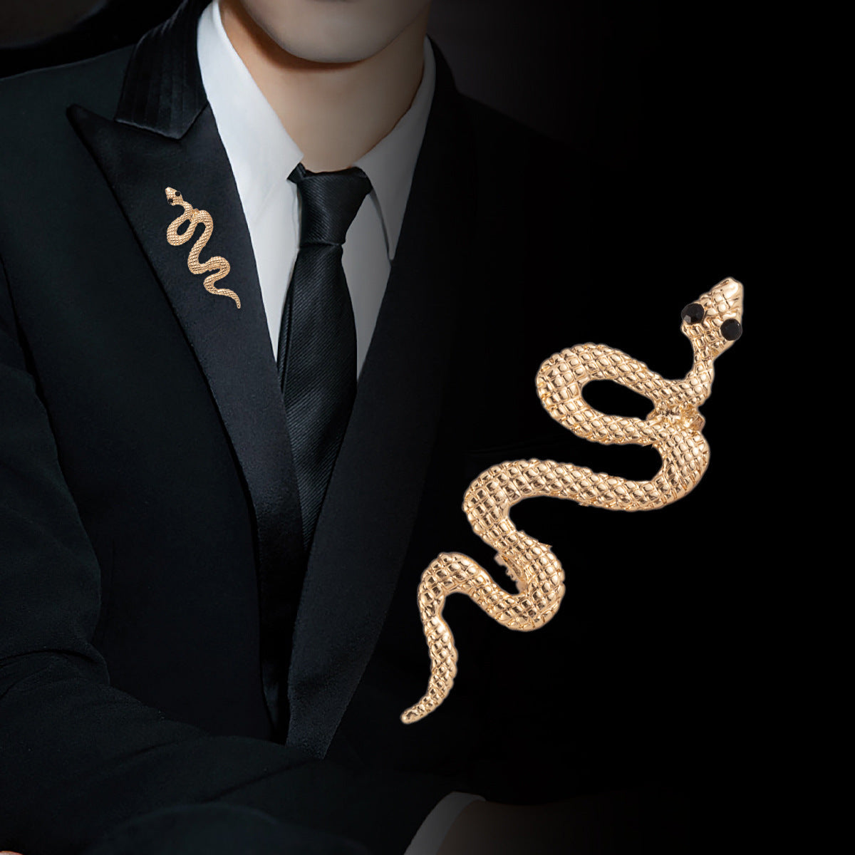 Gold snake lapel pin on dark blazer collar