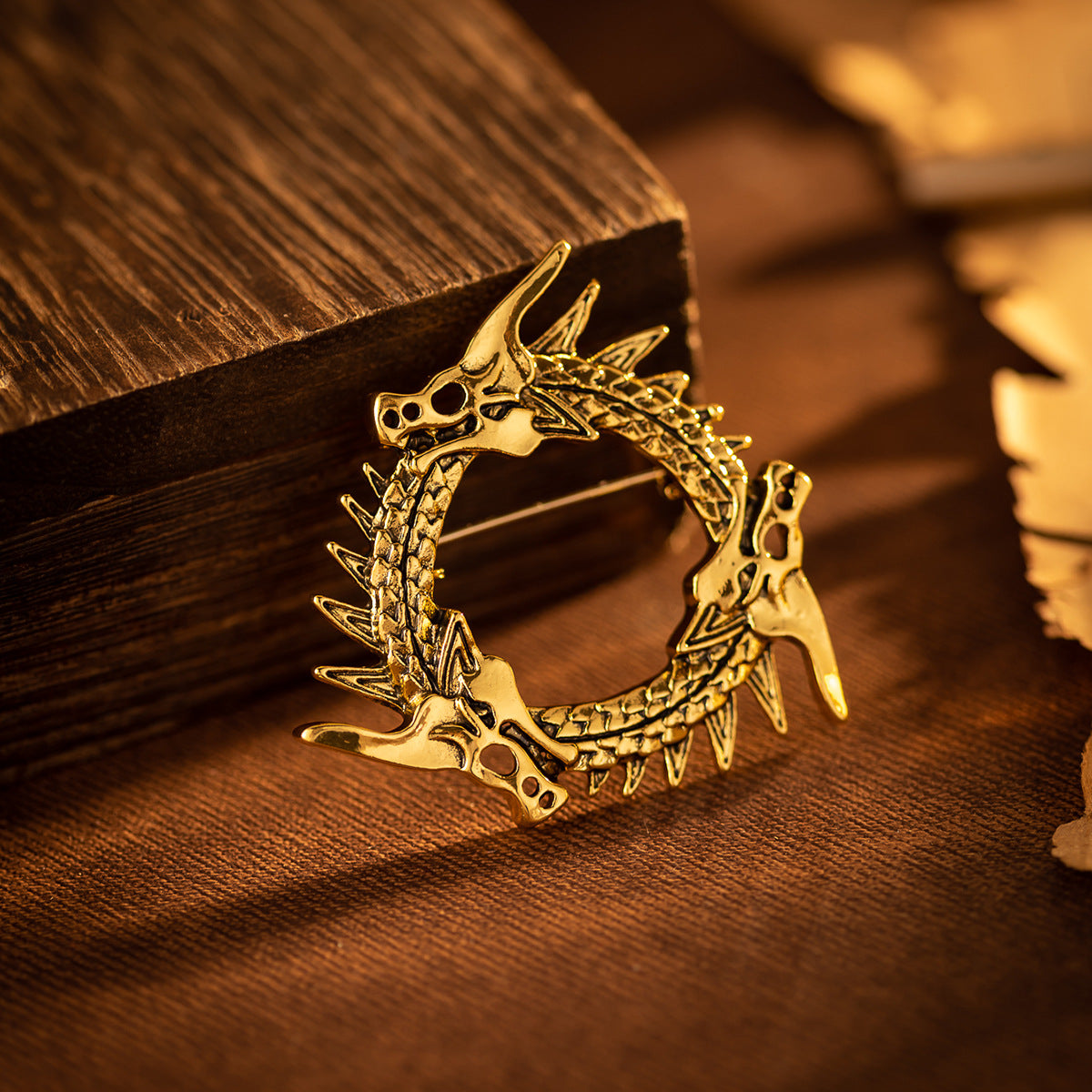 Circular three-headed dragon brooch, antique gold finish, open ring design