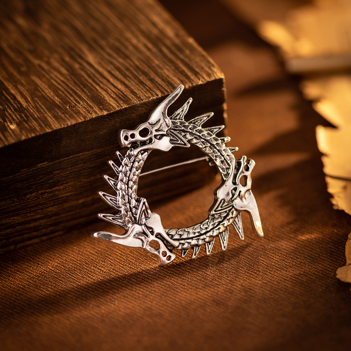 Circular three-headed dragon brooch, antique silver vintage pin with ring of heads