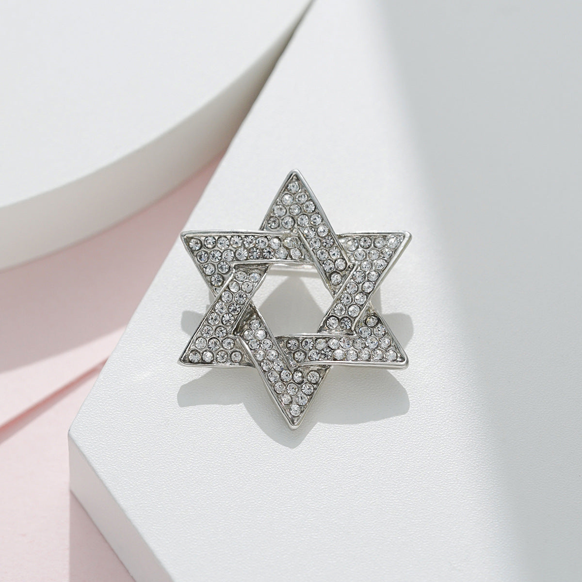 Silver six-point star brooch pin with clear rhinestone sparkle