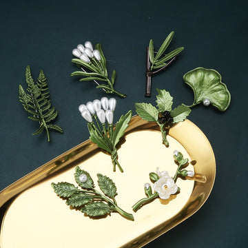 Green 3D leaf brooch pin with white pearl teardrops and green foliage design