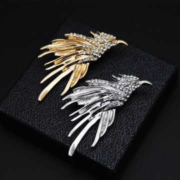 Eagle metal brooch badge in gold and silver tones with rhinestone accents